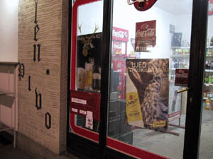 shop window of the Jelen Beer retail store at night